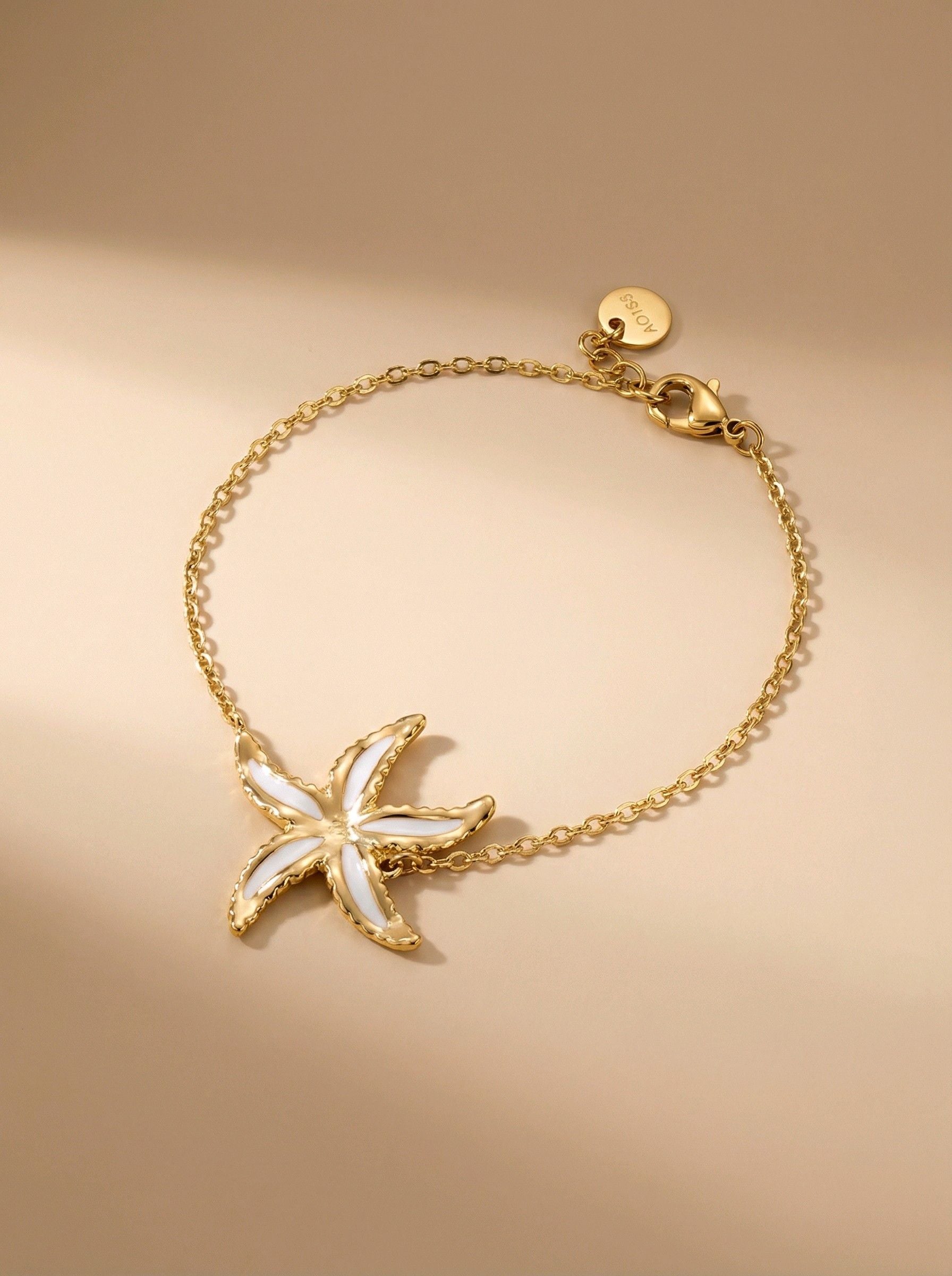 White star - Bracelet étoile de mer blanche et dorée en acier inoxydable