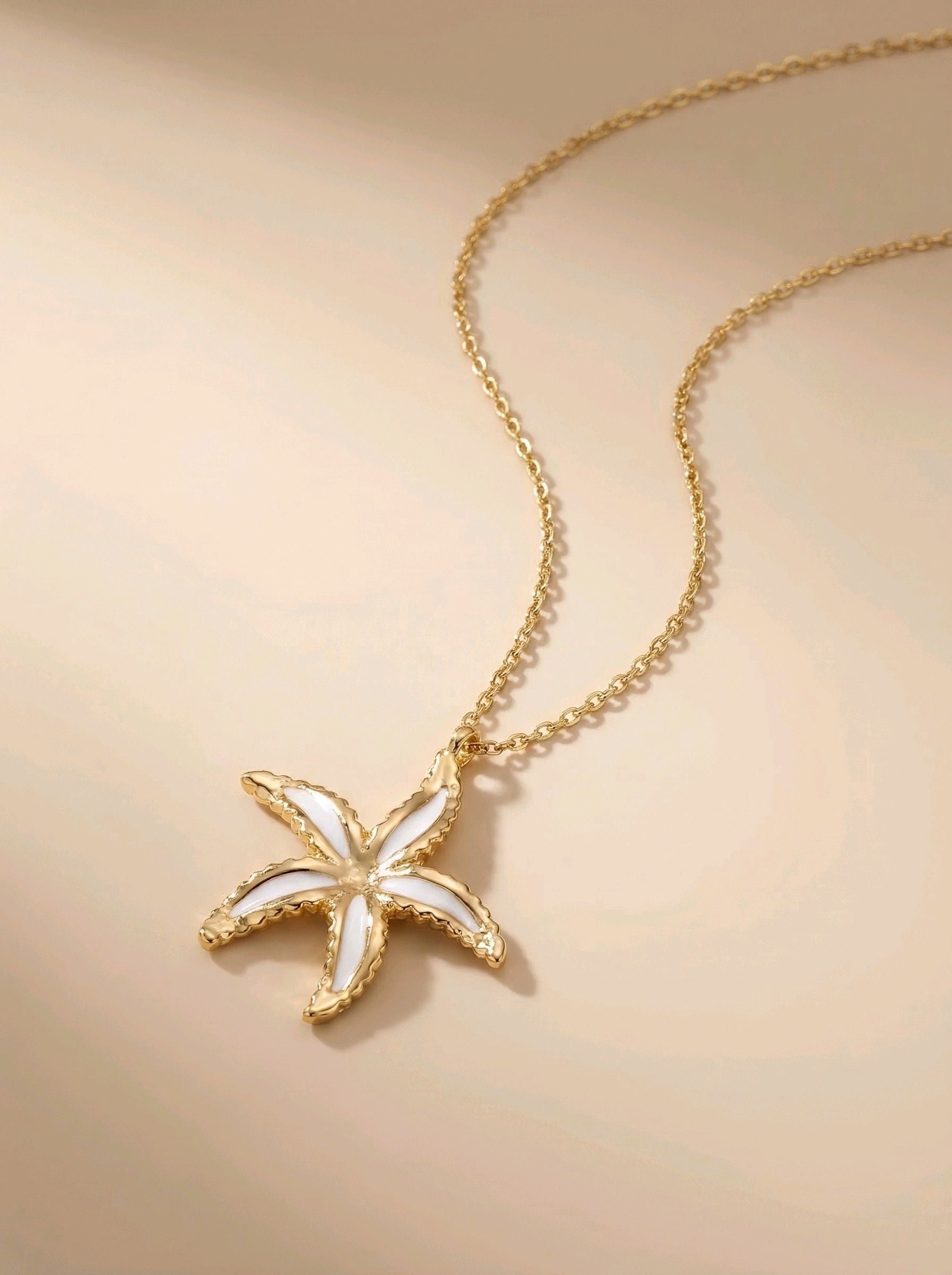 White star - Collier étoile de mer blanche et dorée en acier inoxydable