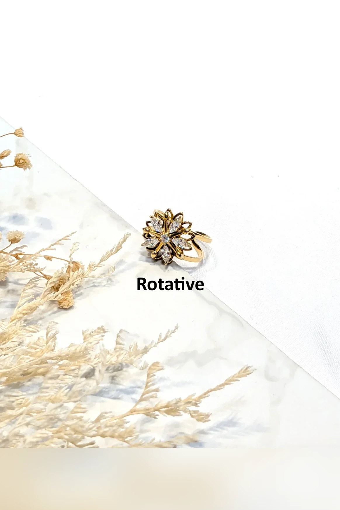Giralda - Bague rotative fleur sertie